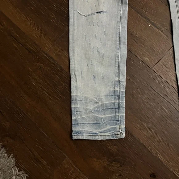 Amiri Light Wash Distressed Skinny Jeans